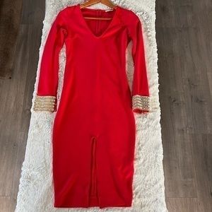 Red midi dress with front opening, long sleeves with diamonds and chain